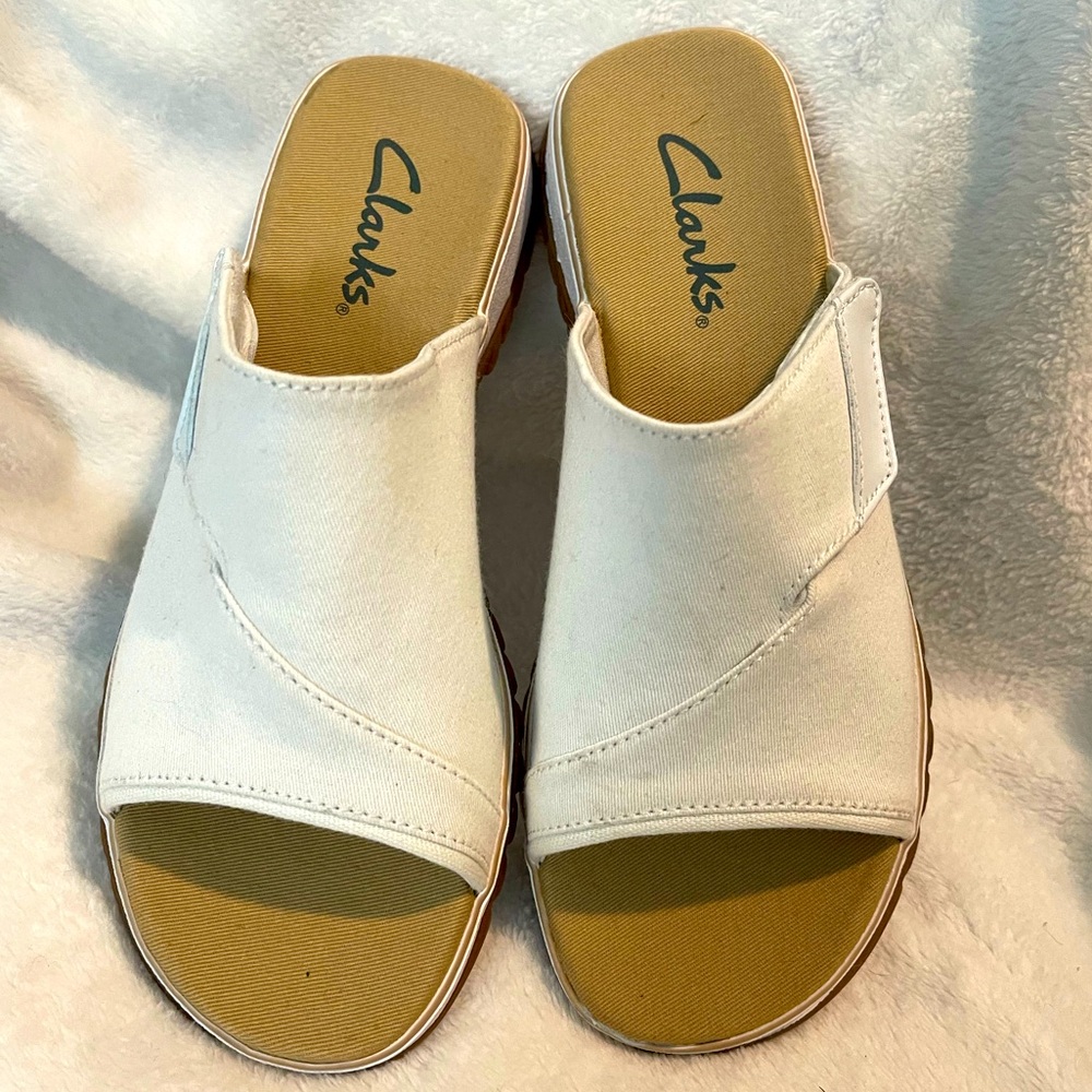 Woman’s Clark’s white sandals